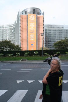 [Picture: Camera raven in front of EU building with sign saying: It's about Europe, it's about you]