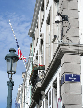 [Picture: American flag under camera surveilance at US embassy]